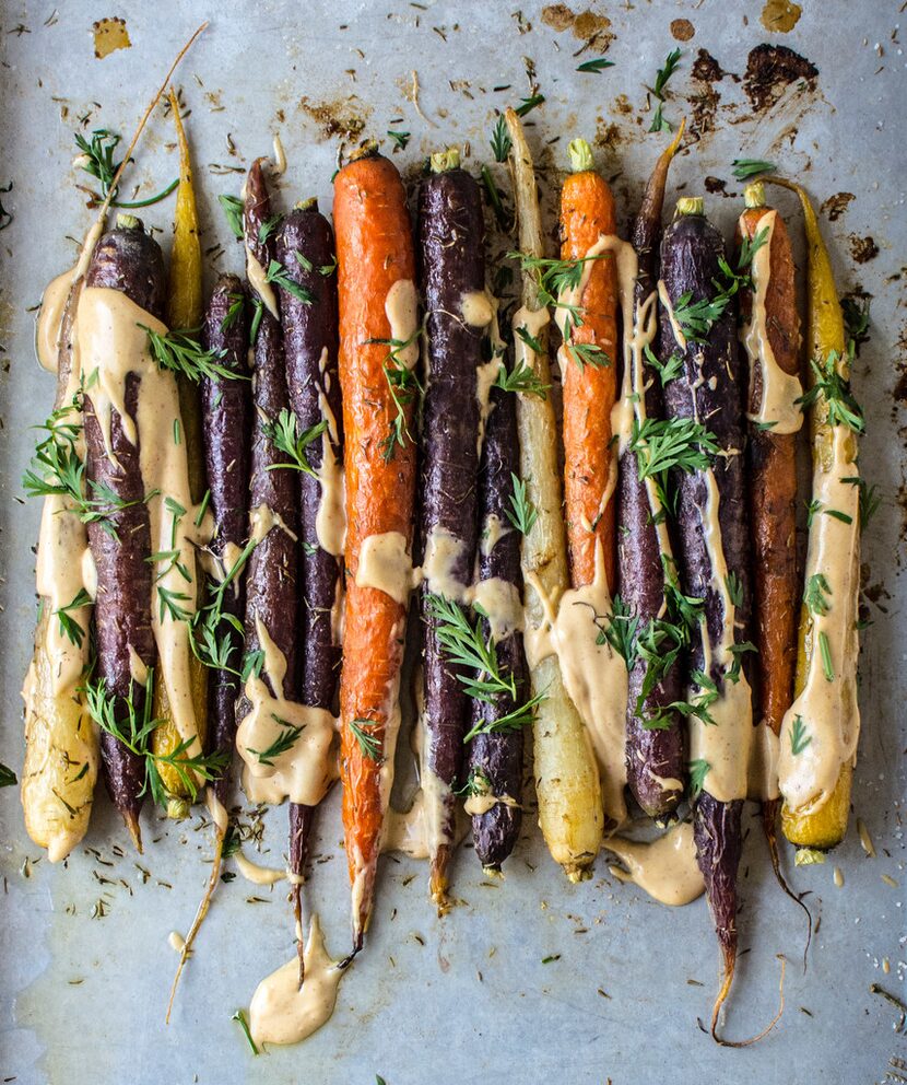 Roasted Sesame Ginger Carrots with Spicy Tahini and Carrot Greens 