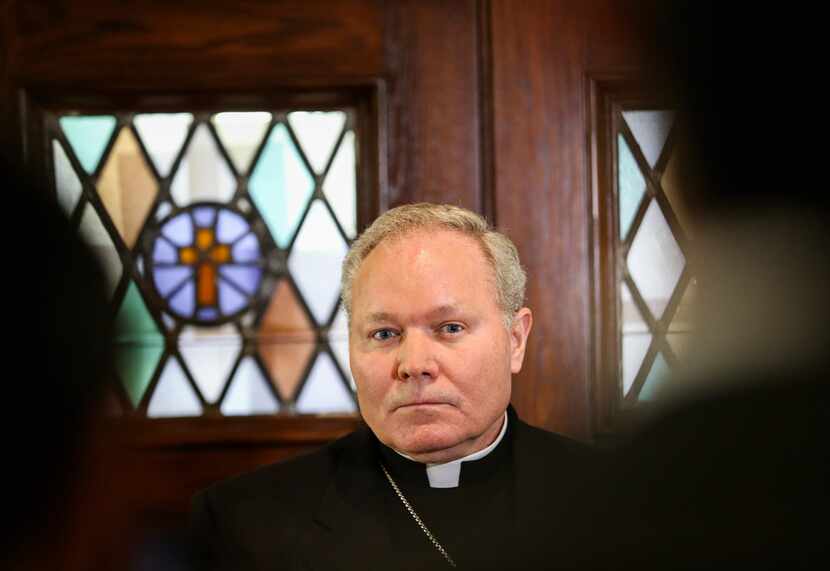 Dallas Bishop Edward J. Burns spoke to members of the media after a police raid on several...