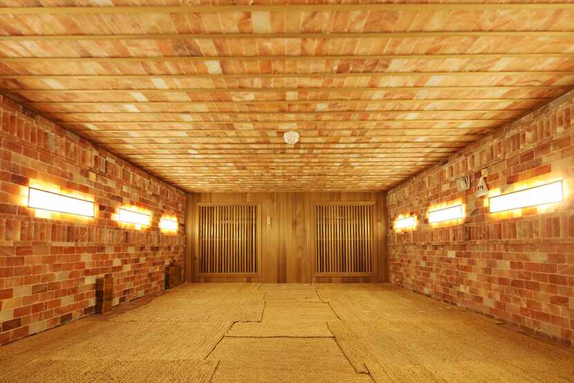 Spa Castle's new Sauna Yoga classes take place in its Himalayan Salt sauna. The room is...