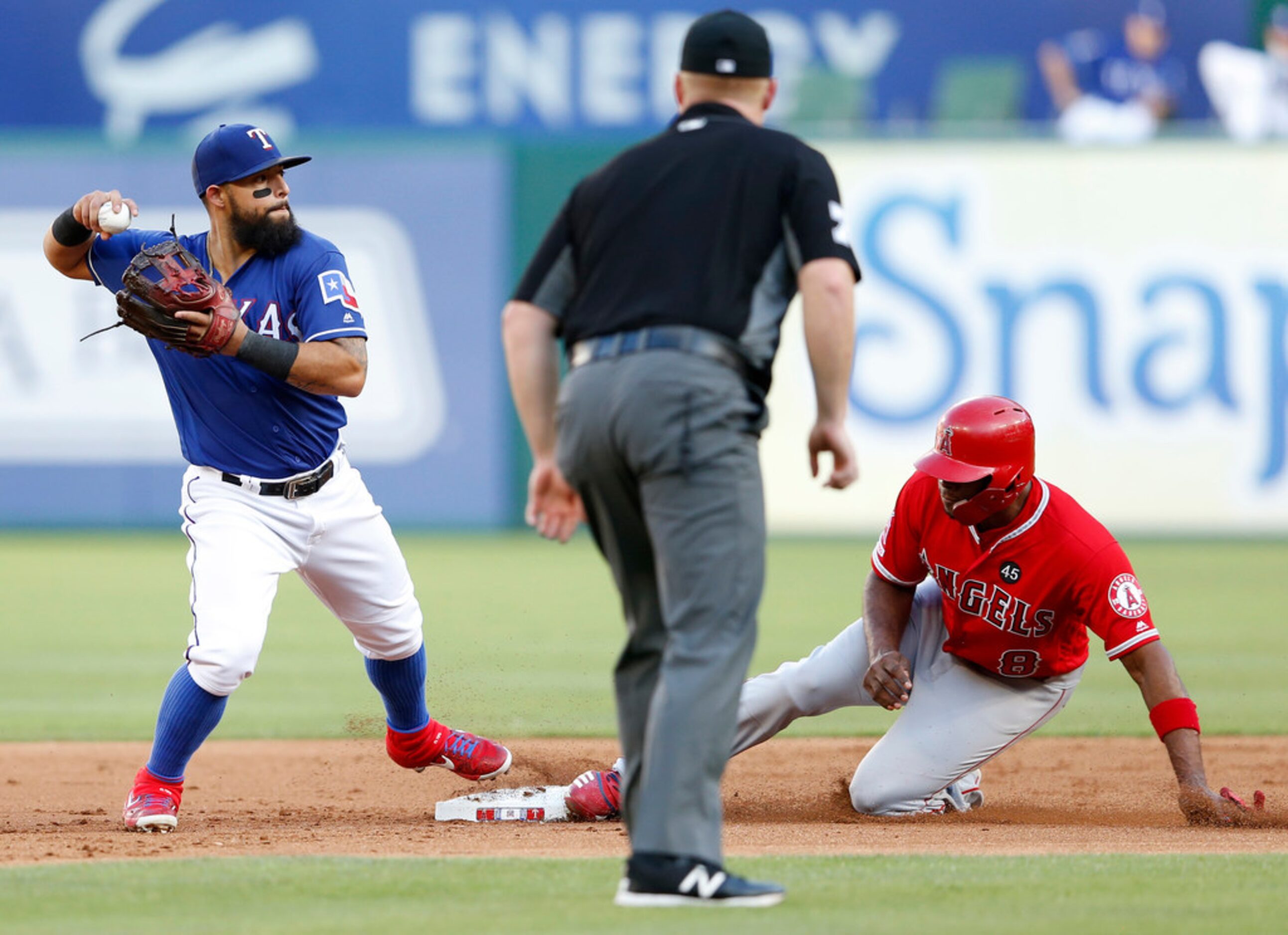 Texas Rangers second baseman Rougned Odor (12) looks to throw to first after forcing out Los...