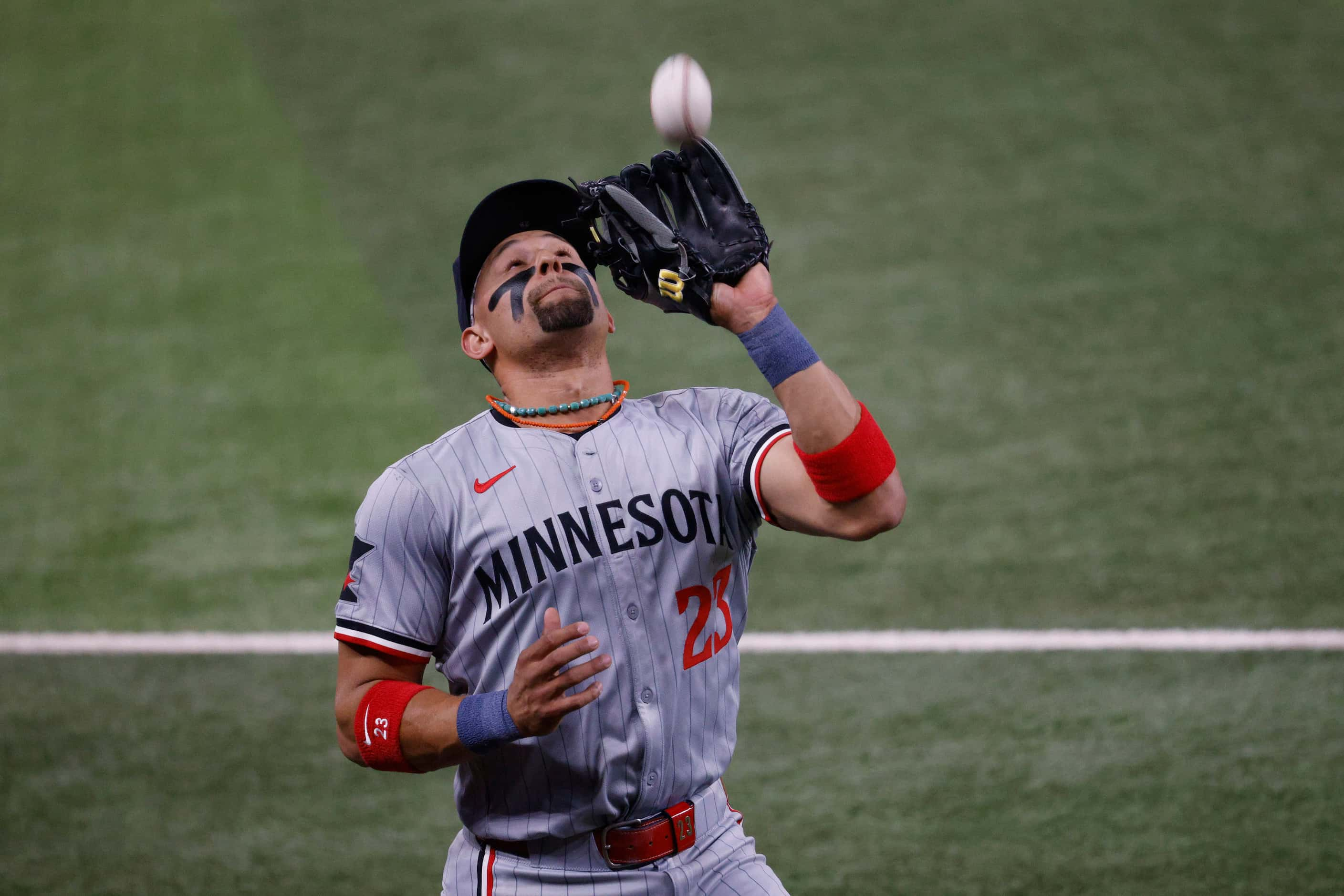 Minnesota Twins third base Royce Lewis (23) catches a foul ball hit by Texas Rangers...