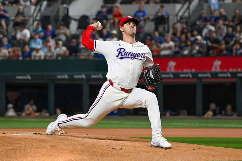 Texas Rangers pitcher Tyler Mahle pitches in the first inning of a baseball game against the...