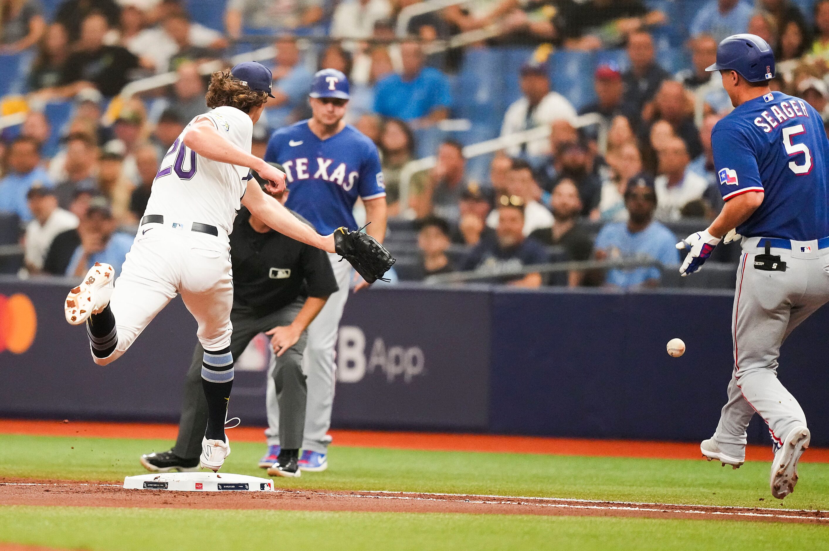 Texas Rangers shortstop Corey Seager (5) is safe at first base as Tampa Bay Rays starting...