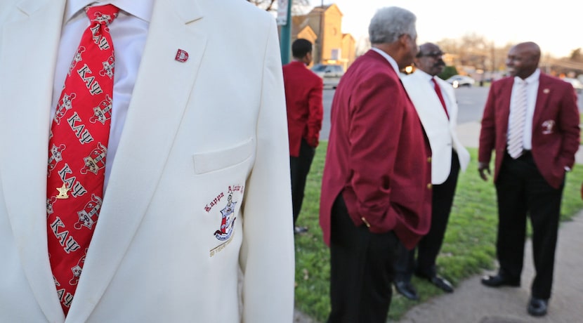 Kappa Alpha Psi 50-year member Stephen Washington displays his necktie as members gather at...