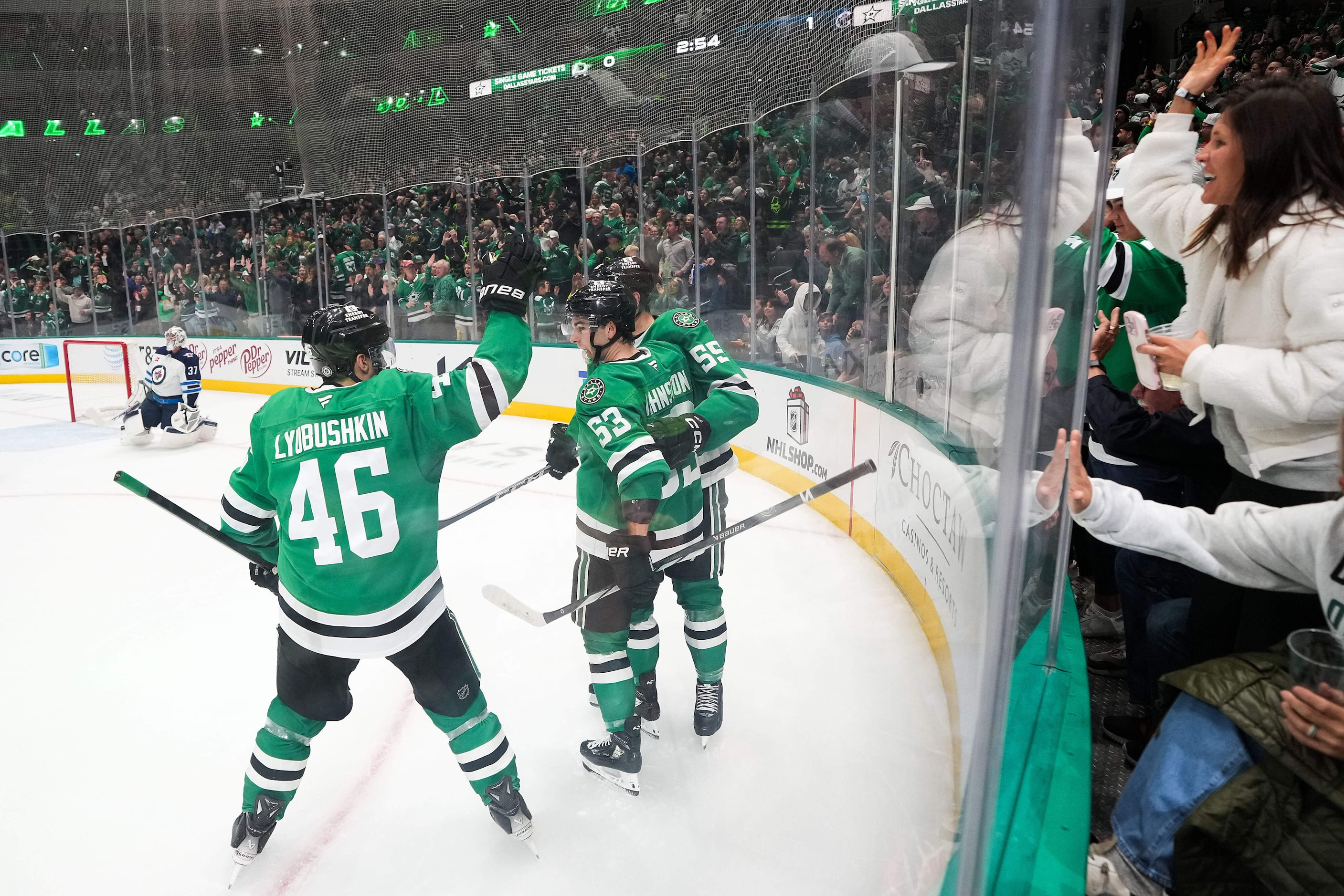 Dallas Stars center Wyatt Johnston (53) celebrates a goal with defenseman Ilya Lyubushkin...