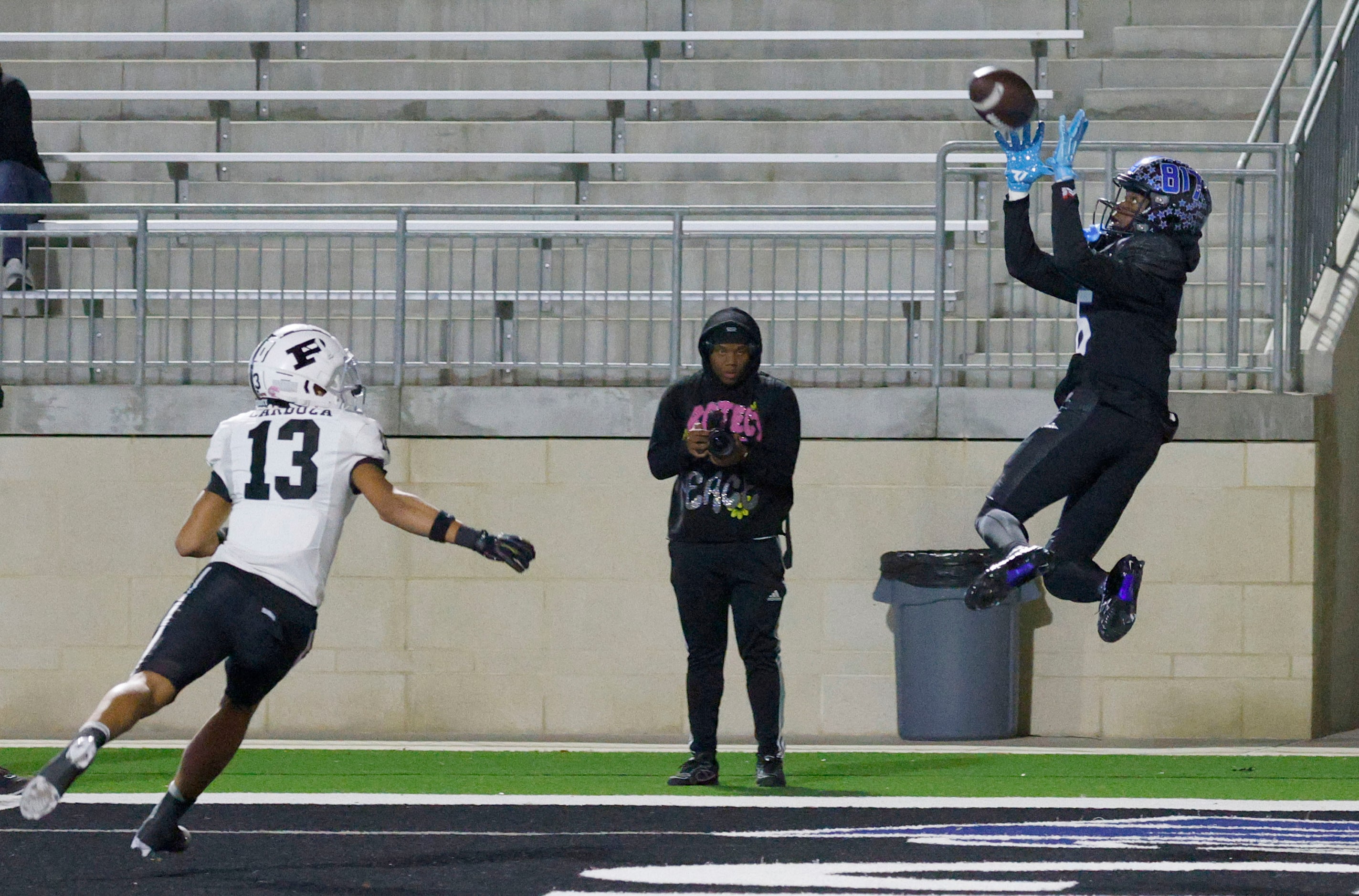 North Crowley's Quentin Gibson catches a touchdown pass as Permian's Nata Cardoza (13) looks...