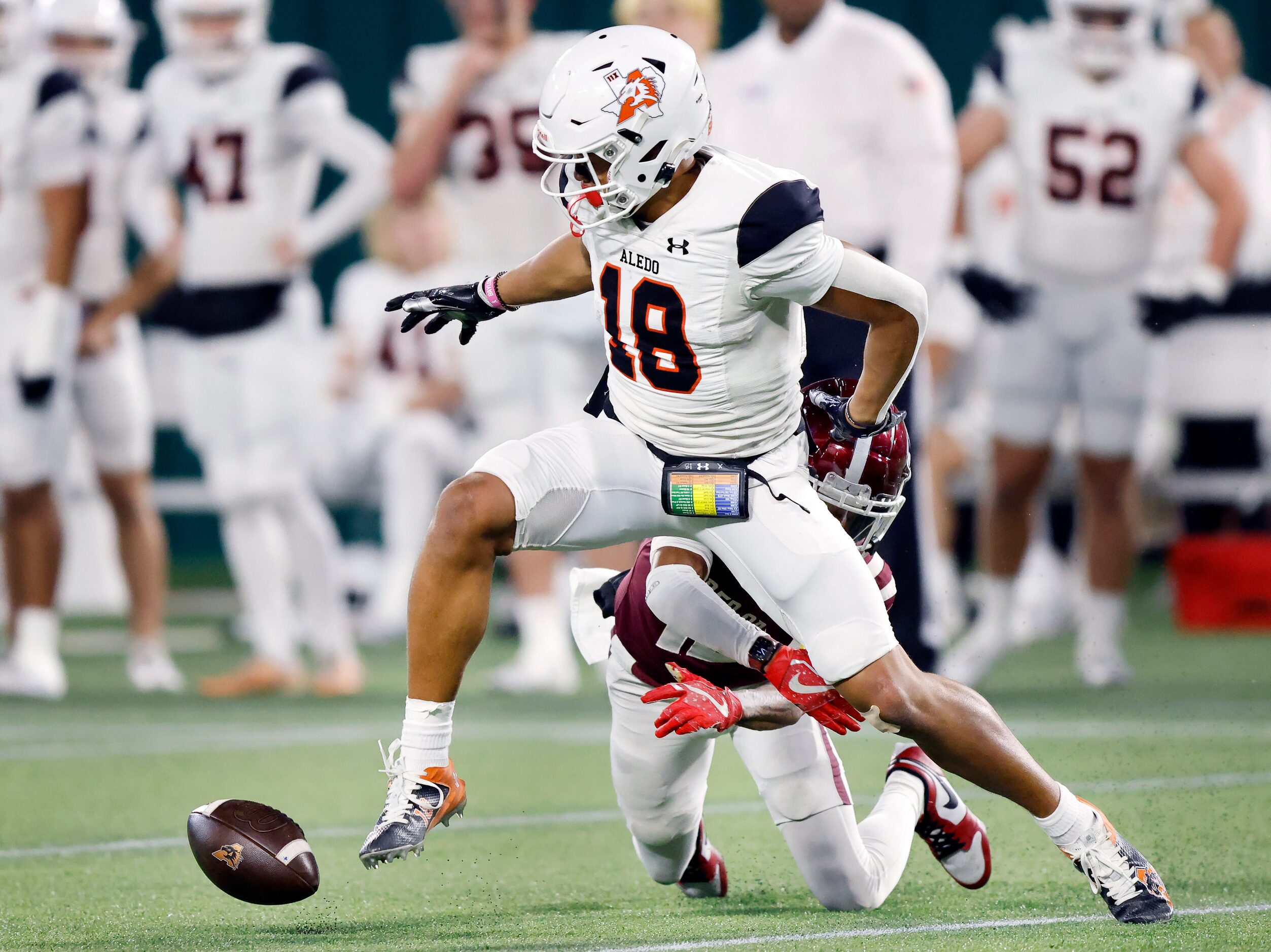 Aledo wide receiver Kaydon Finley (18) fumbles the ball after a second quarter pass...