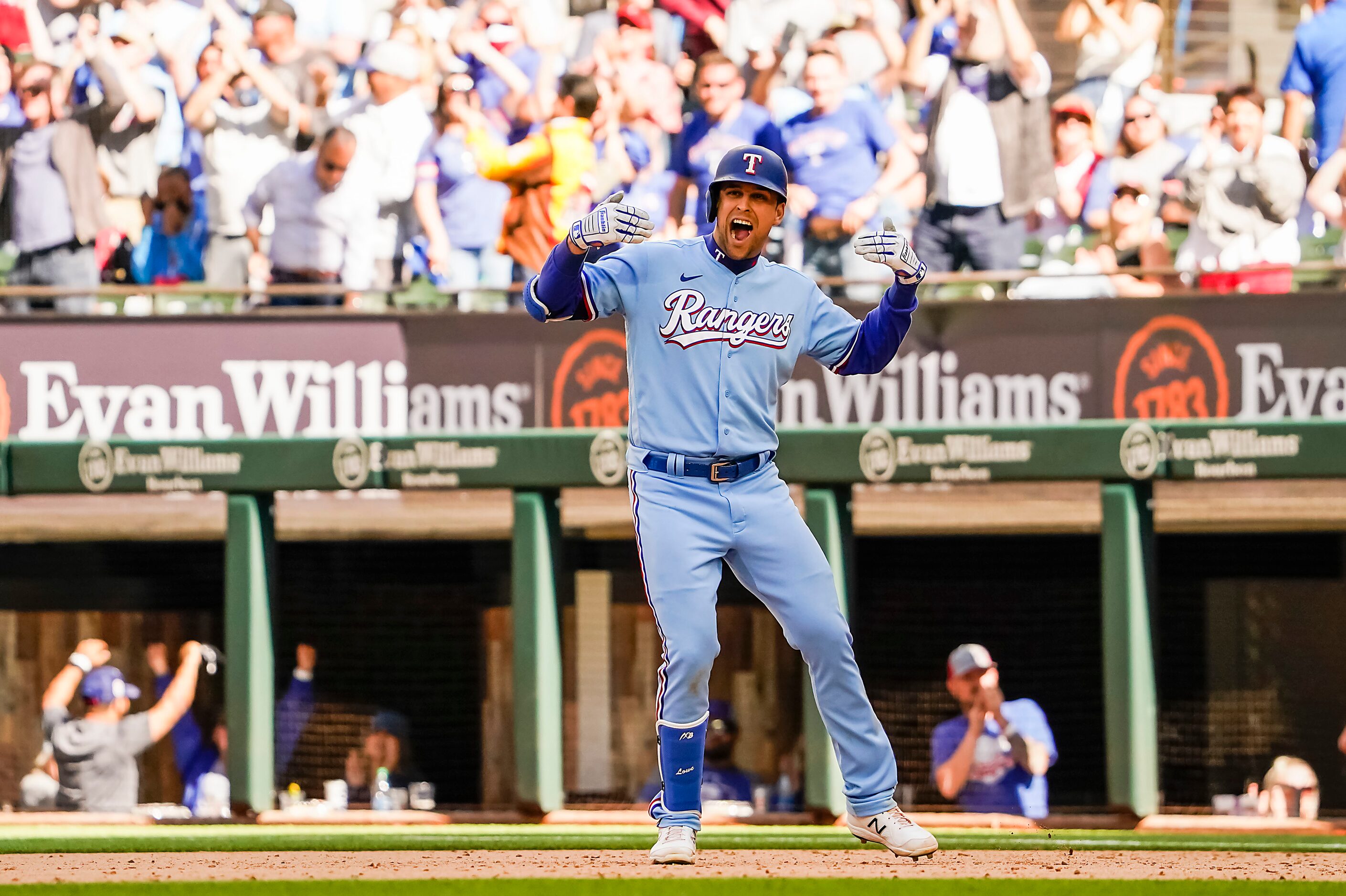 Texas Rangers first baseman Nate Lowe celebrates after hitting a walk-off single during the...