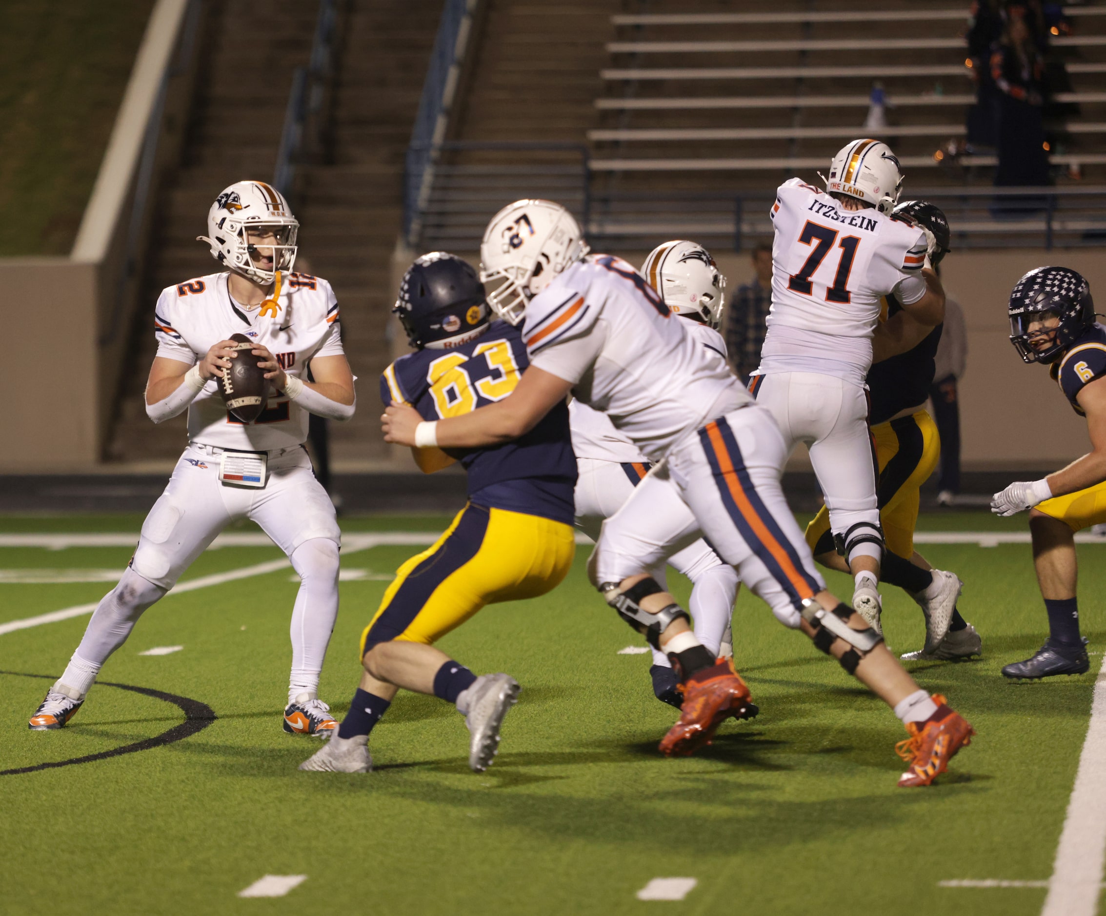 Frisco Wakeland's Jayden Maples looks for an open receiver in a football playoff game...