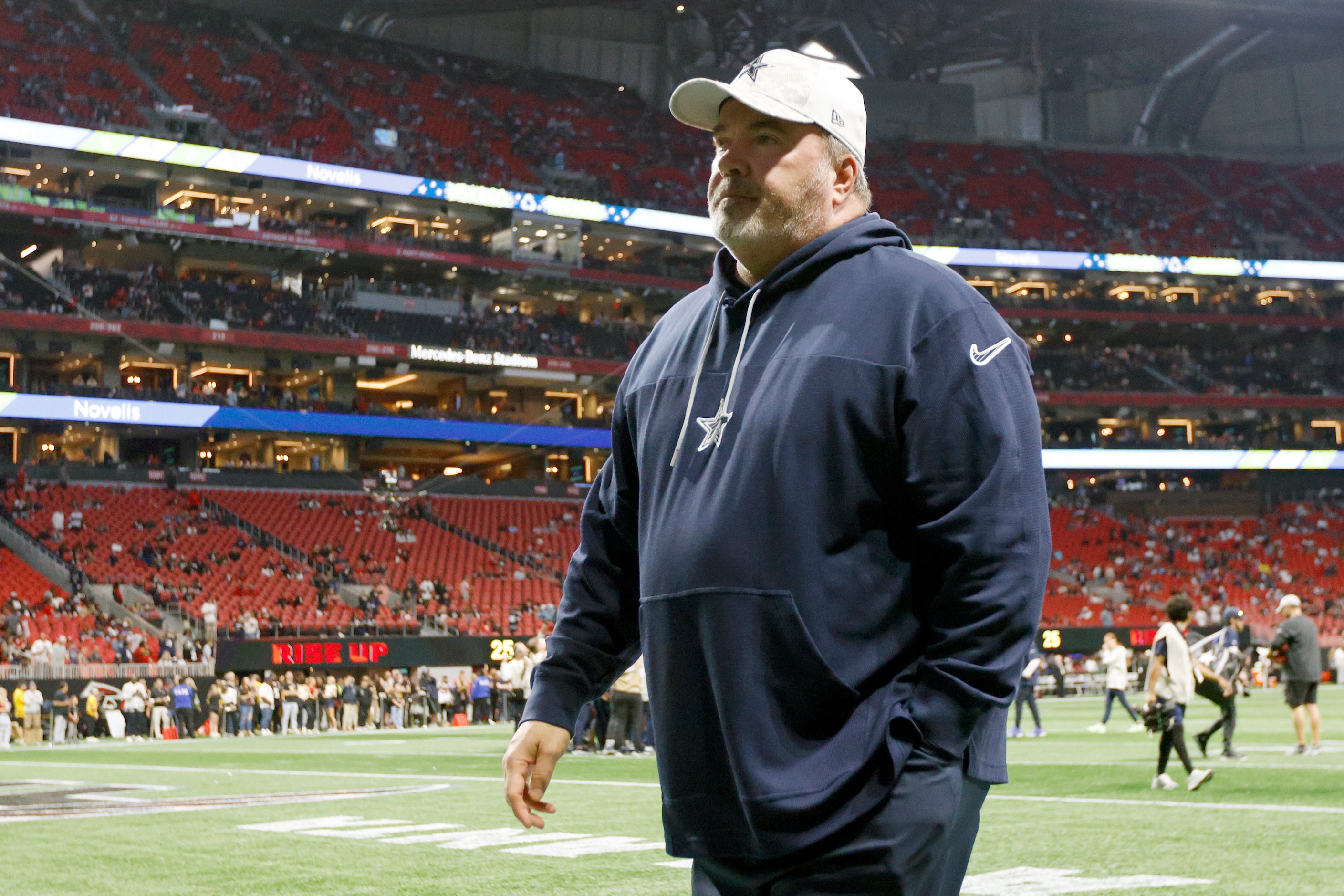 Dallas Cowboys head coach Mike McCarthy walks off the field before a game between against...