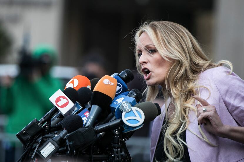 FILE-- Stephanie Clifford, the porn star better known as Stormy Daniels, speaks to reporters...
