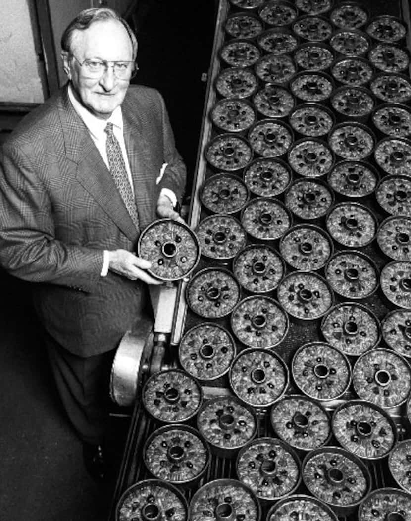 Bill McNutt Jr., President of the  Collin Street Bakery in Corsicana, stands near some of...