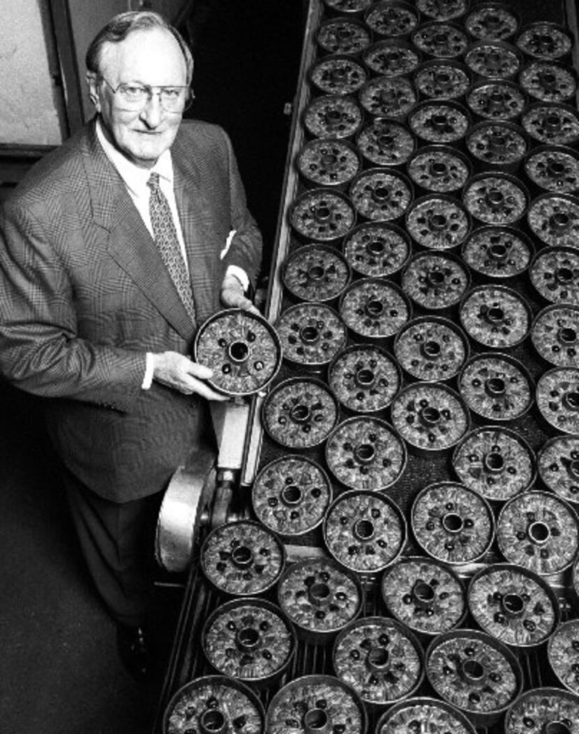 Bill McNutt Jr., President of the  Collin Street Bakery in Corsicana, stands near some of...
