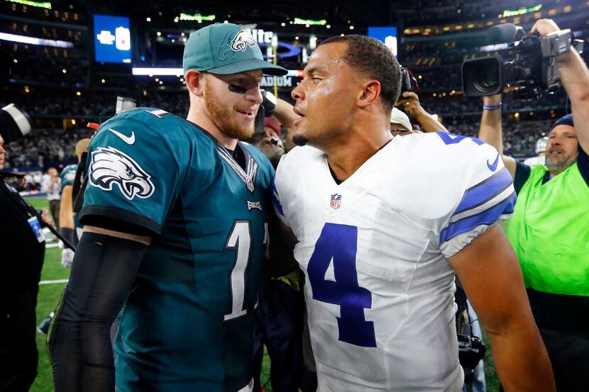 FILE - Philadelphia Eagles quarterback Carson Wentz (11) congratulates Dallas Cowboys...