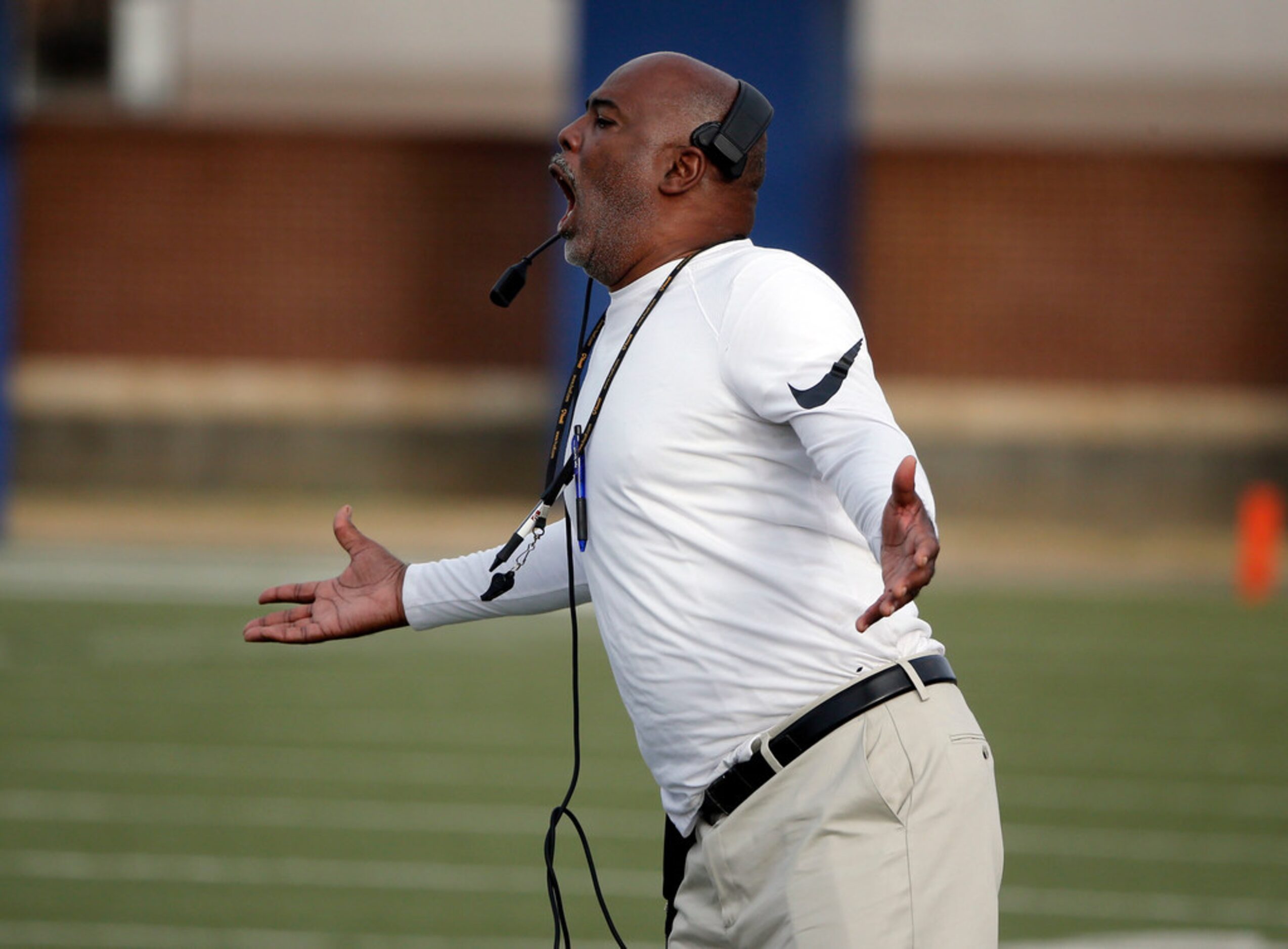 Duncanville football coach Reginald Samples argues a call as they played Lewisville during...