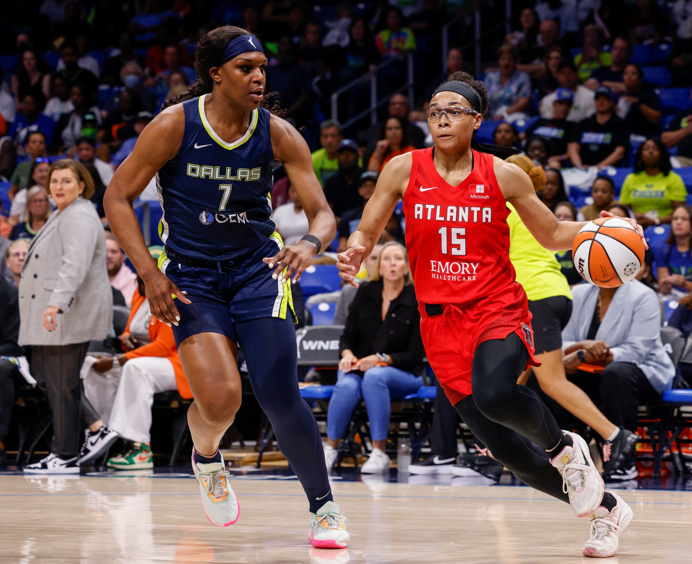 Atlanta Dream guard Allisha Gray (15) drives against a defending Dallas Wings center Teaira...