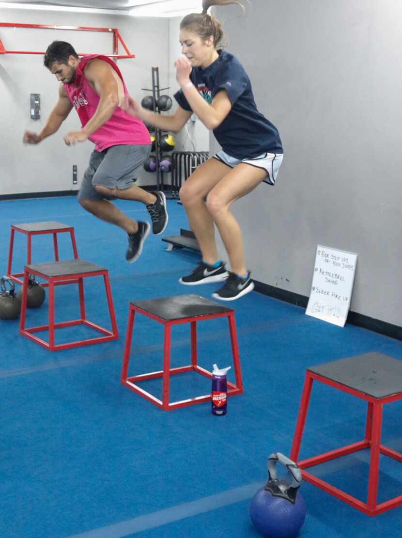 Thomas Karam (left) and Sam Nelson at the box jump station during a high intensity workout...