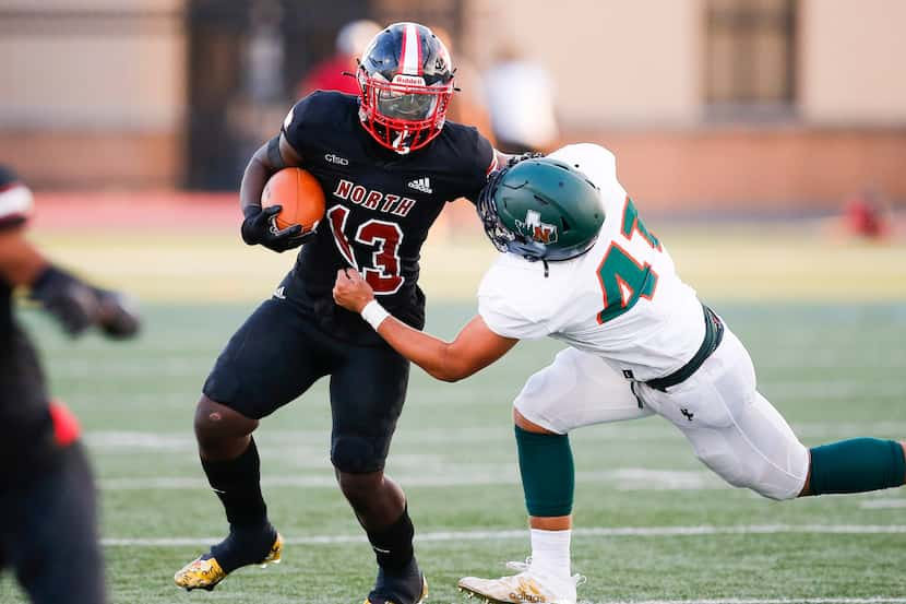 Garland Naaman Forest senior linebacker Chandler Davis (41) tackles North Garland sophomore...