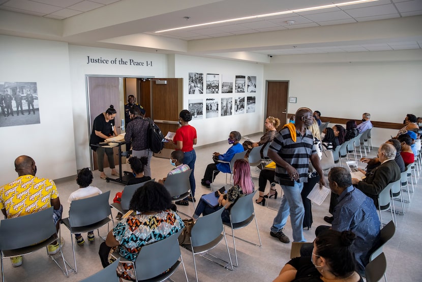 Defendants facing eviction waited for their cases to be heard at the justice of the peace...