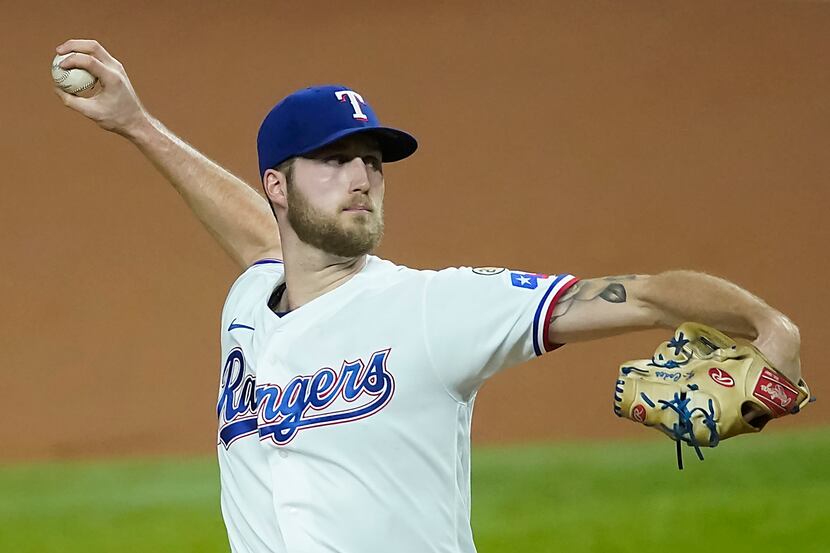 Texas Rangers starting pitcher Kyle Cody delivers during the first inning against the Los...