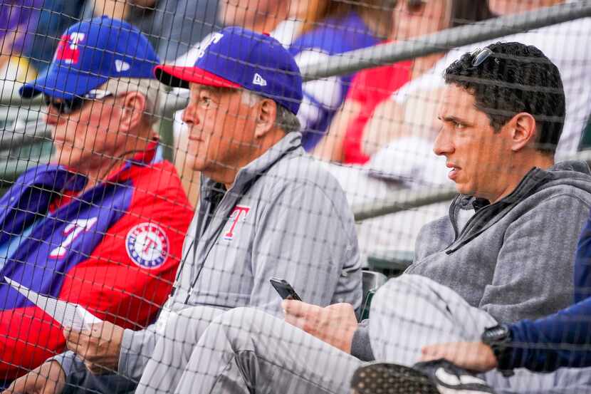 FILE - Rangers GM Jon Daniels (right) watches a spring training game with co-chairman and...