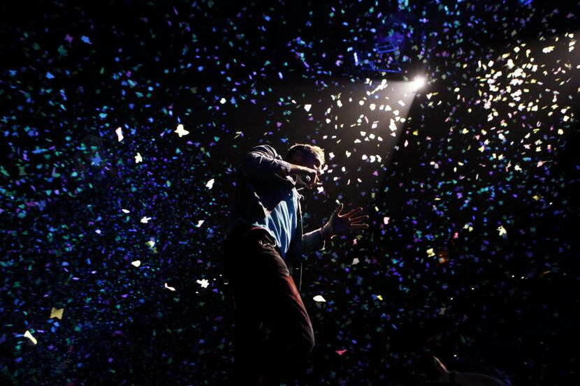 Chris Martin sings during Coldplay performs at American Airlines Center in Dallas, TX on...