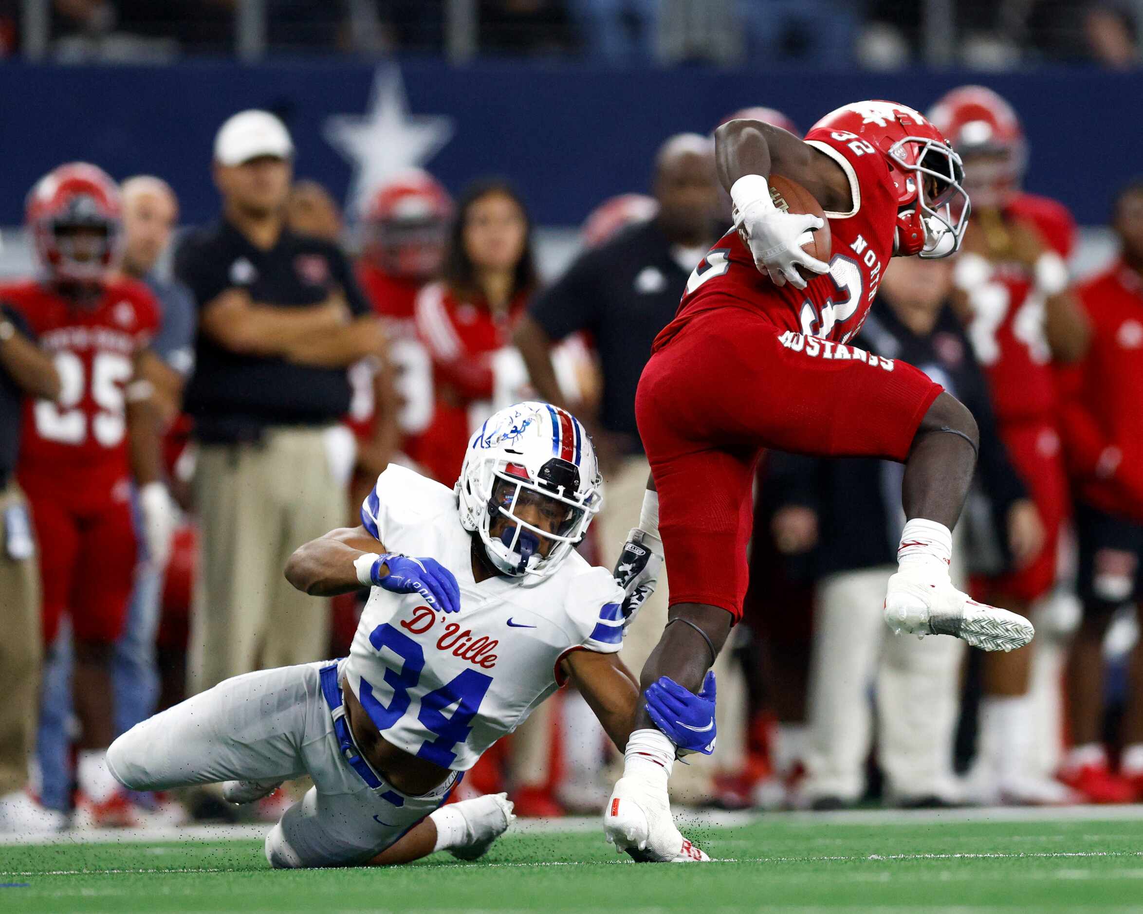 Duncanville linebacker Donovan McFail (34) trips Galena Park North Shore running back Xavier...