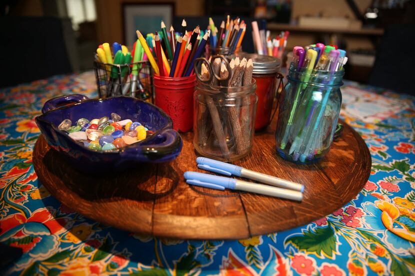 A lazy susan of supplies inside Jill Allison Bryan's creativity space at her home in Dallas...
