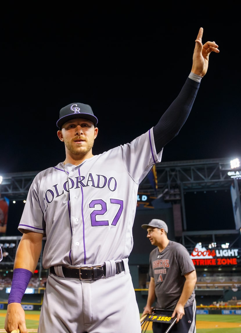 Apr 4, 2016; Phoenix, AZ, USA; Colorado Rockies shortstop Trevor Story reacts following the...