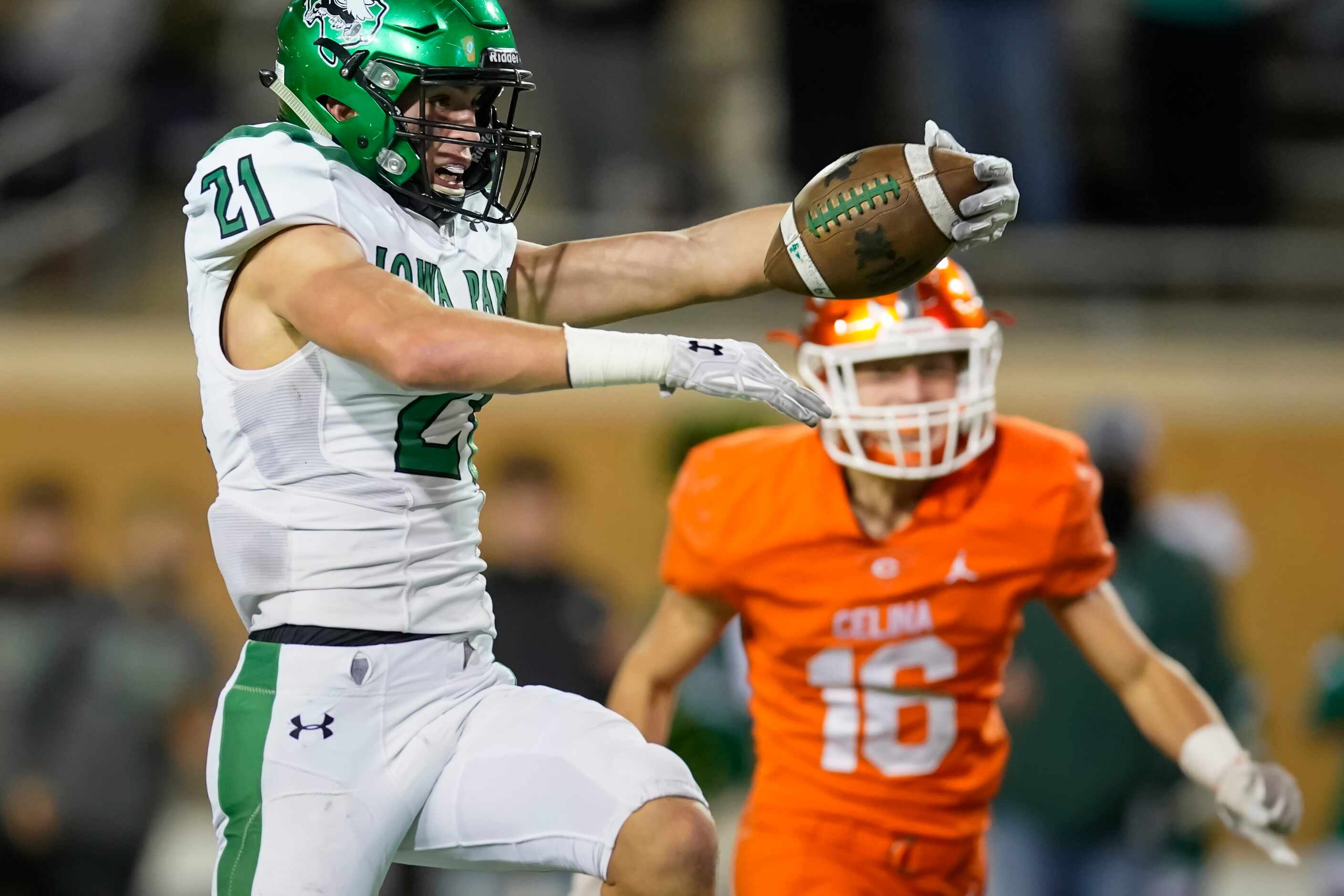 Iowa Park wide receiver Ty Cunningham (21) celebrates as he gets past Celina defensive back...