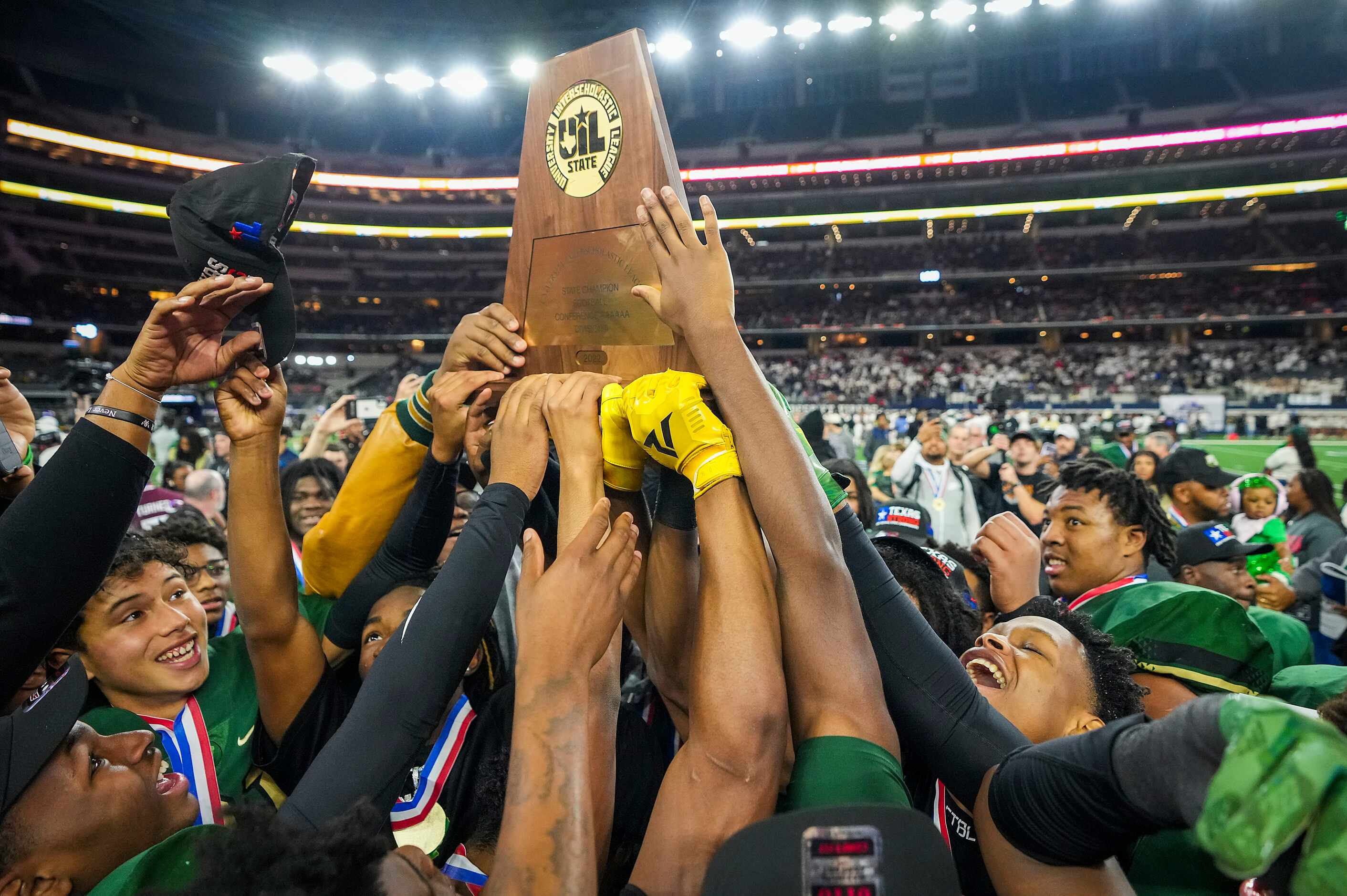 DeSoto players lift the championship trophy after a victory over Austin Vandegrift in the 6A...