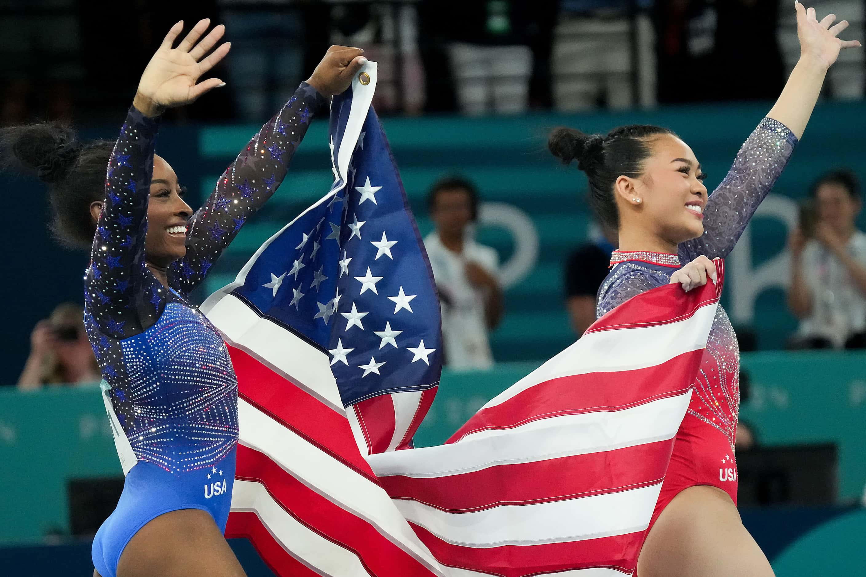 Gold medalist Simone Biles (left) and bronze medalist Suni Lee of the United States...