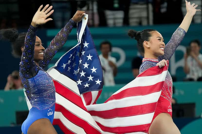 Gold medalist Simone Biles (left) and bronze medalist Suni Lee of the United States...