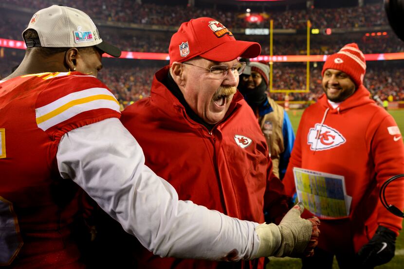Kansas City Chiefs head coach Andy Reid, center, celebrates with Chiefs defensive end Frank...