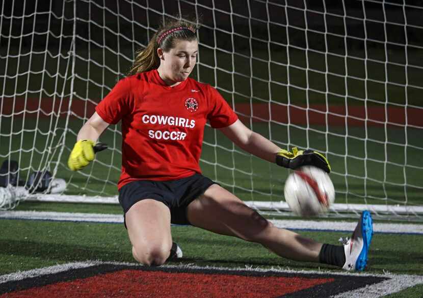 
Coppell Cowgirls goalie Rachel Johnson, a senior, stops a shot during an early morning...