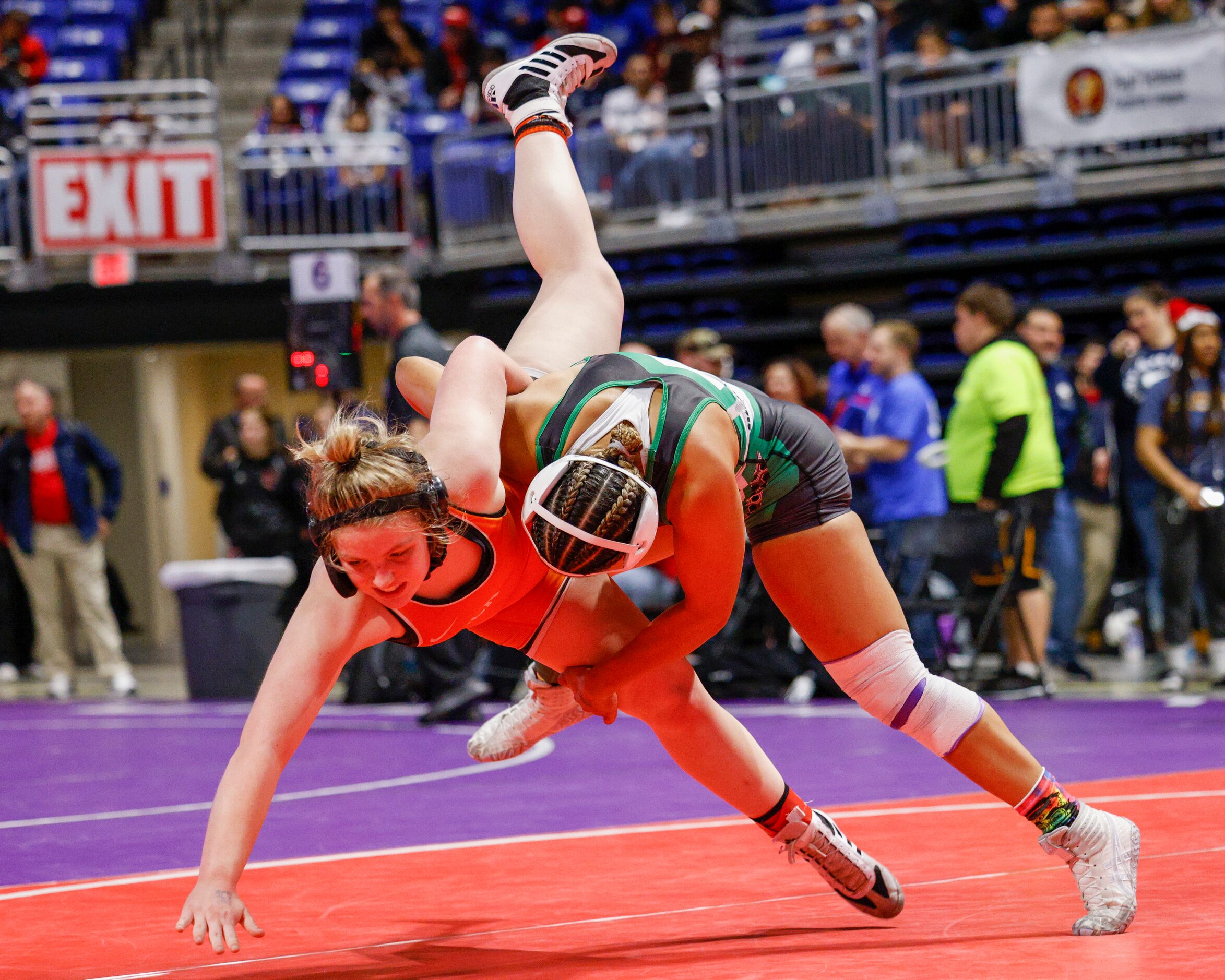 Aremie Steele of El Paso Montwood (right) takes down Marqelle Fisher of Rockwall during a...