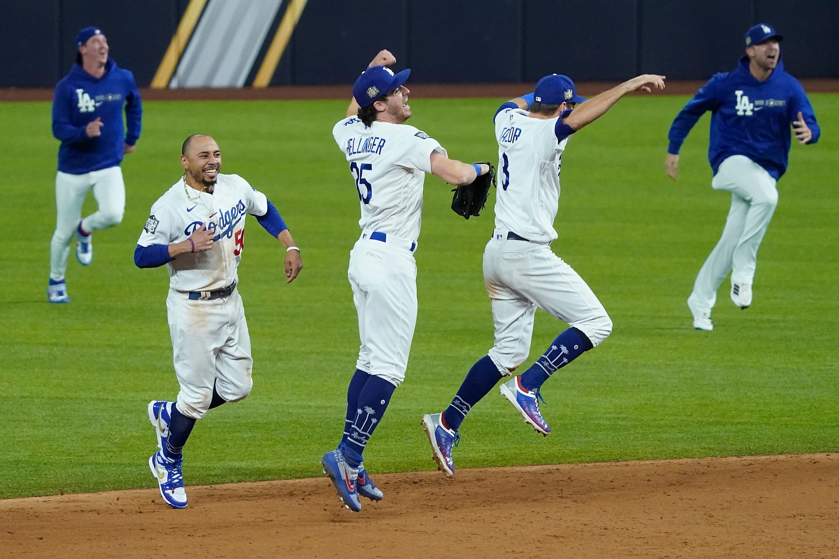 Los Angeles Dodgers right fielder Mookie Betts (50), center fielder Cody Bellinger (35) and...