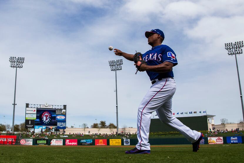 Texas Rangers third baseman Adrian Beltre (29) warms up before a spring training baseball...