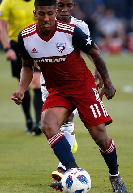 FC Dallas midfielder Santiago Mosquera (11) blocks out Los Angeles FC forward Latif Blessing...