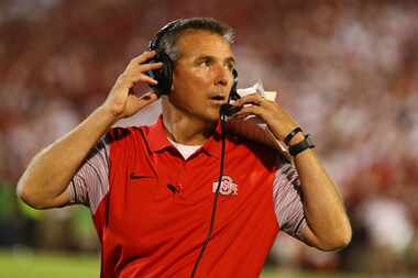 NORMAN, OK - SEPTEMBER 17:  Head coach Urban Meyer of the Ohio State Buckeyes looks on...