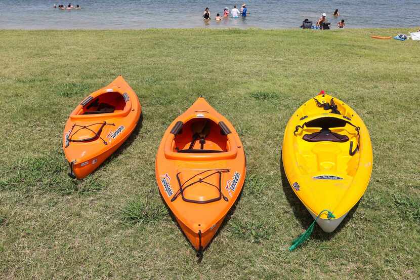 People spend the day at a beach at Collin Park in Lake Lavon, Wylie on Saturday, July 17,...