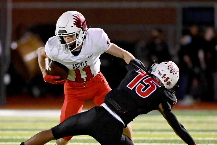 Argyle's wide receiver Ward McCollum (11) tries to run through a tackle attempt by Melissa's...