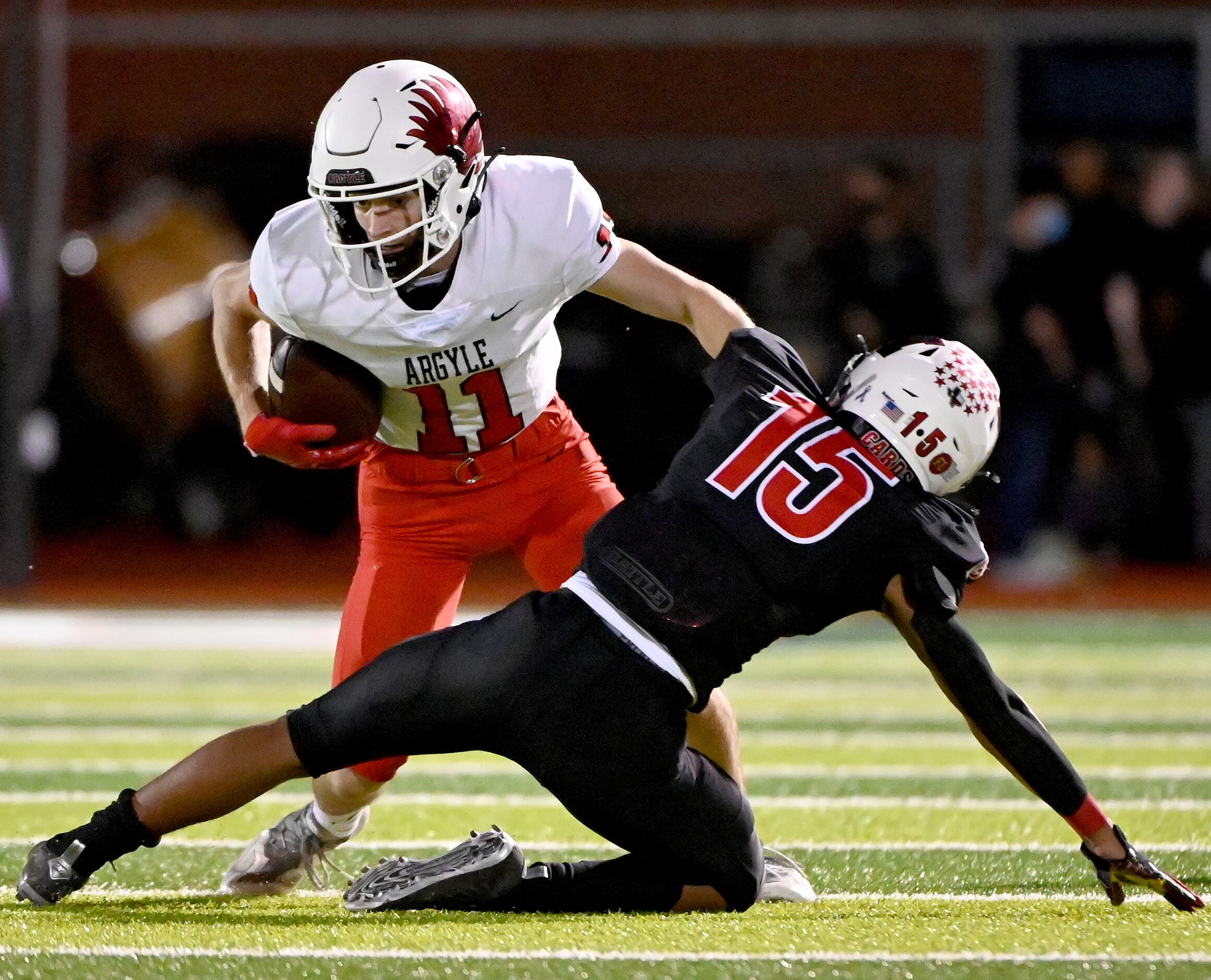 Argyle's wide receiver Ward McCollum (11) tries to run through a tackle attempt by Melissa's...