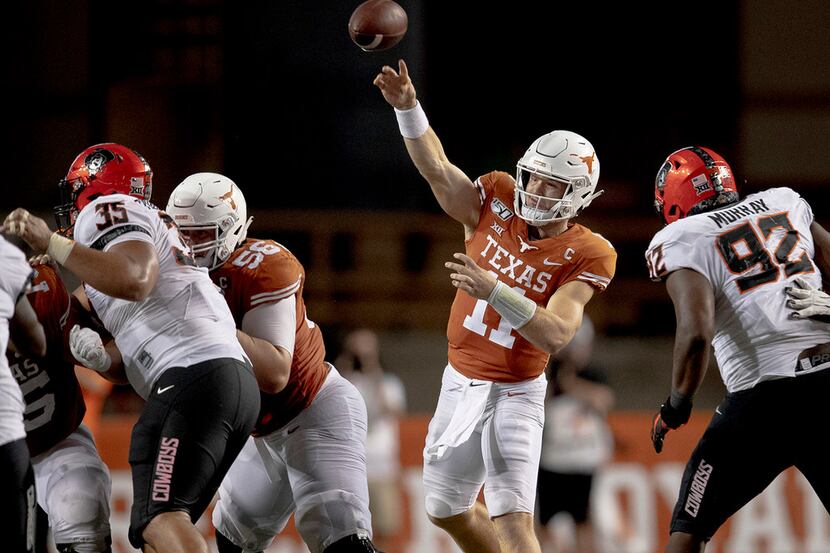Texas quarterback Sam Ehlinger (11) throws the ball against Oklahoma State on Saturday,...