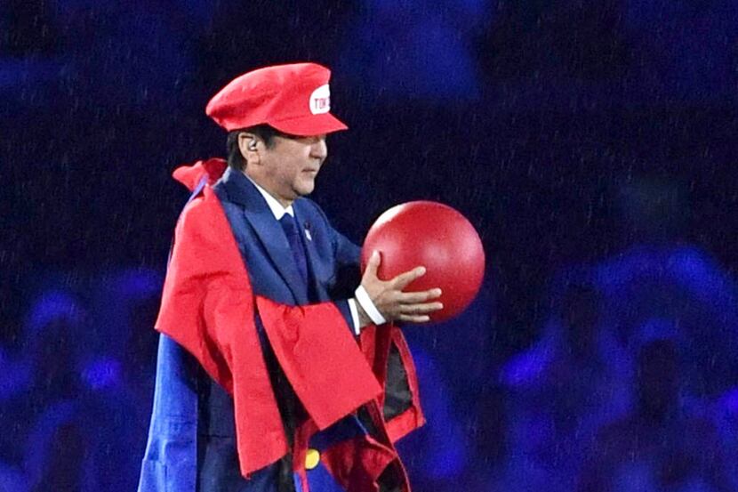 Japanese Prime Minister Shinzo Abe appears as the Nintendo game character Super Mario during...