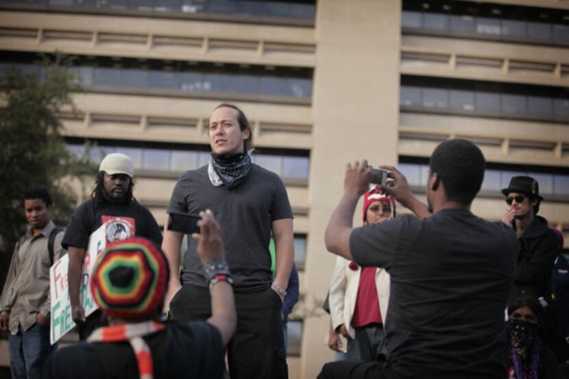 Stephen Benavides spoke to a crowd at the Occupy Dallas camp at City Hall on Friday....