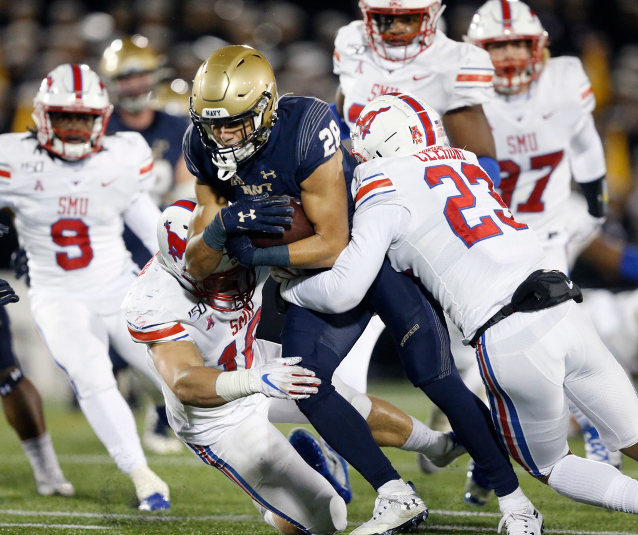 Navy Midshipmen wide receiver Keoni-Kordell Makekau (28) plows through Southern Methodist...