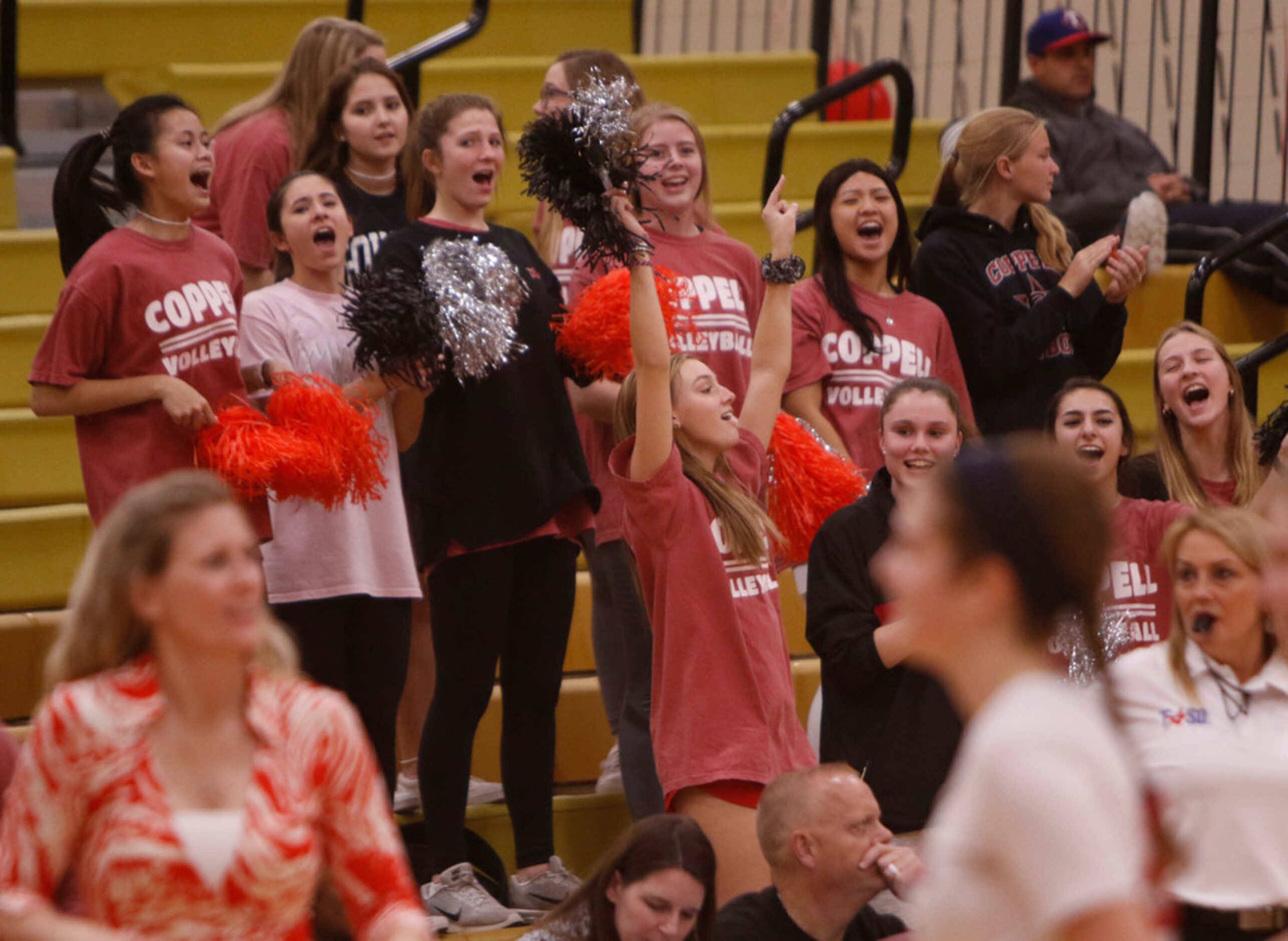 Coppell fans show their vocal support following a score during the second game of their...