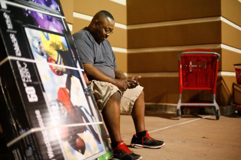 On Black Friday last year, Byron Hall waited with his LCD television as his wife fetched...