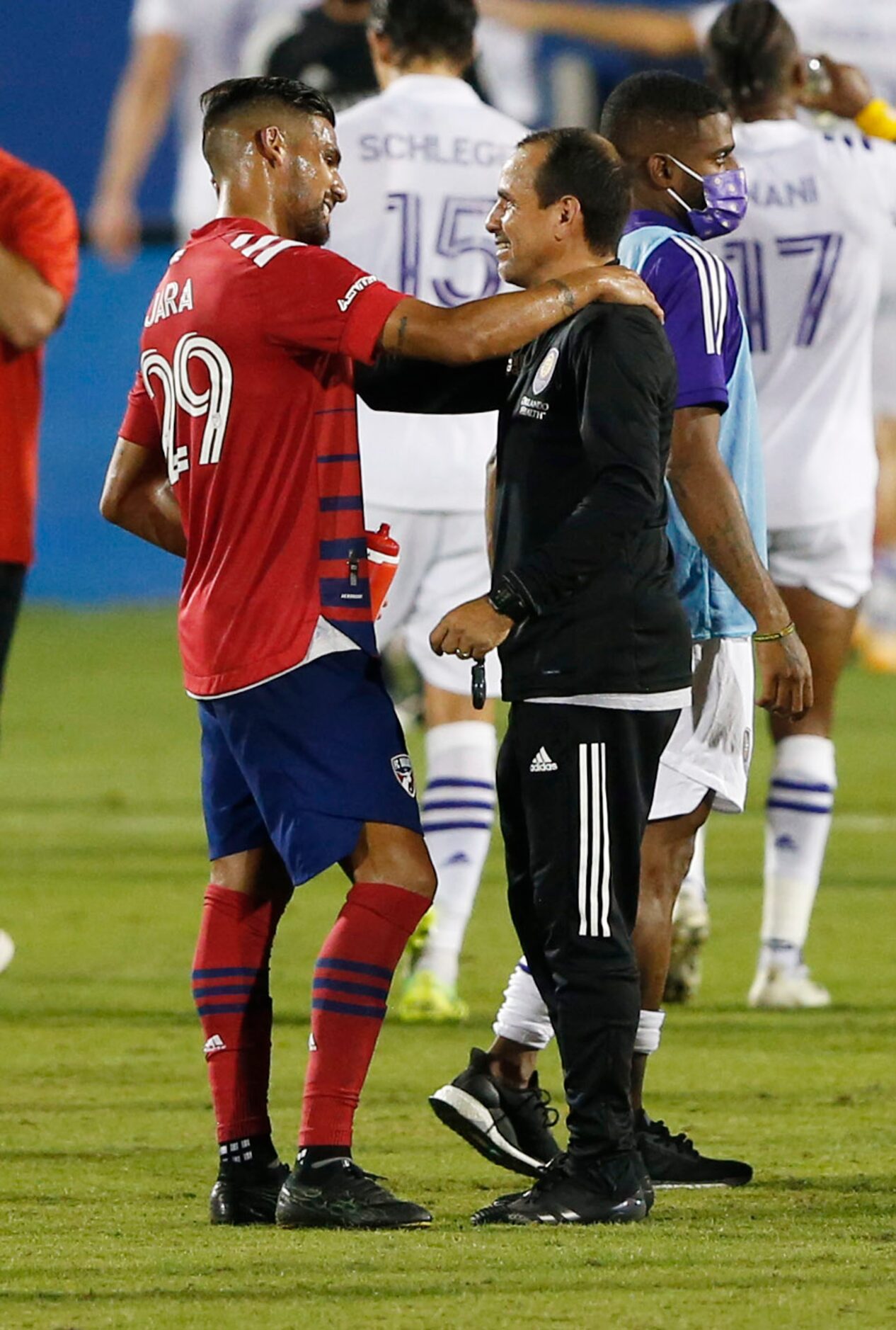 FC Dallas forward Franco Jara (29) talks with Orlando City head coach Oscar Pareja after the...